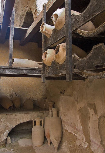 wine amphorae in original wooden racks wine amphorae in original wooden racks