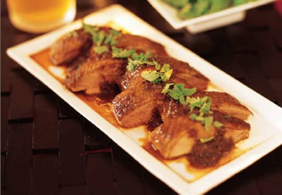 Duck braised in dark soy and tamarind 