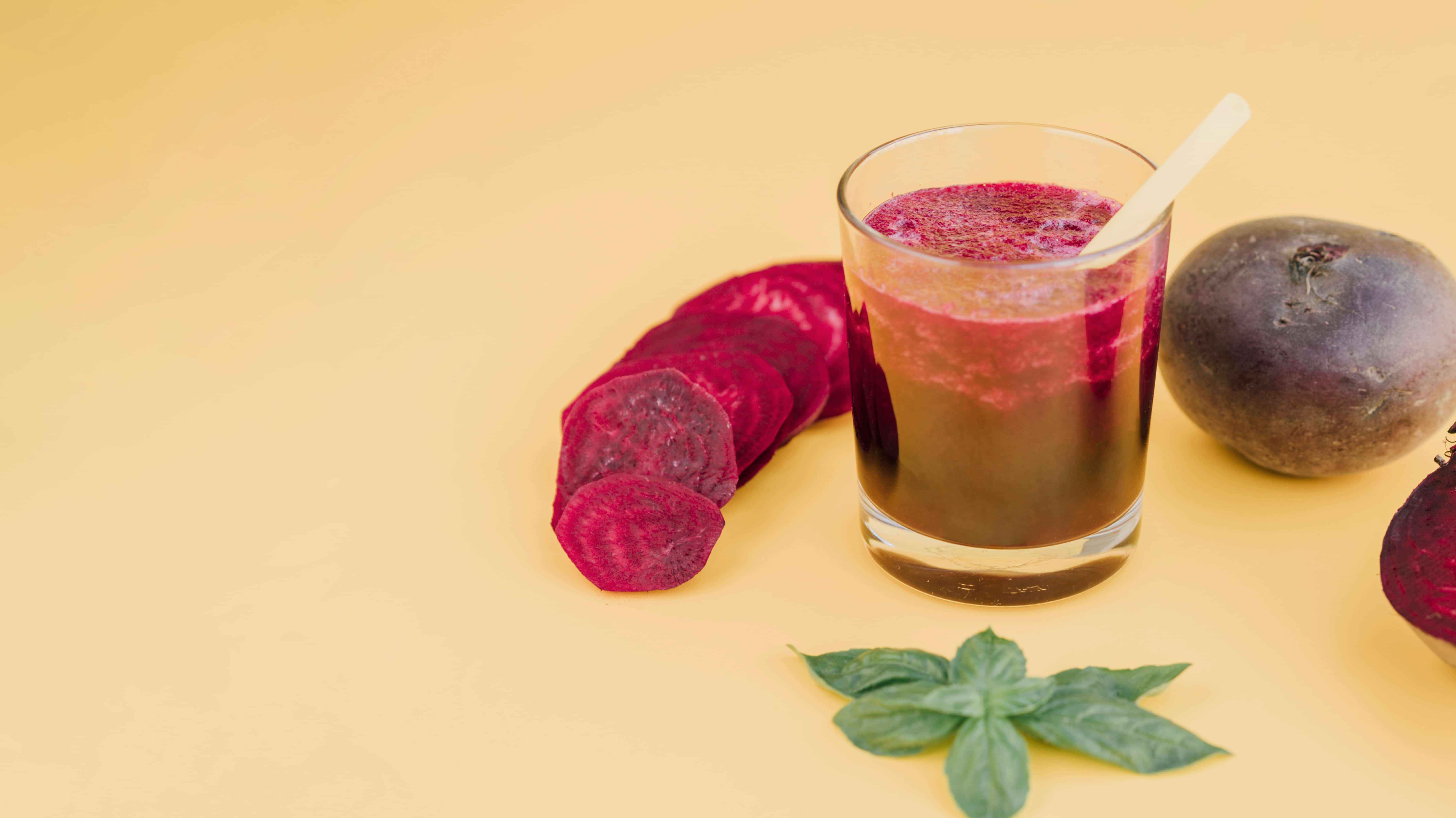 What are the 10 Surprising Beetroot Benefits You Need to Know? 1 Beetroot juice and cut beetroot on the table