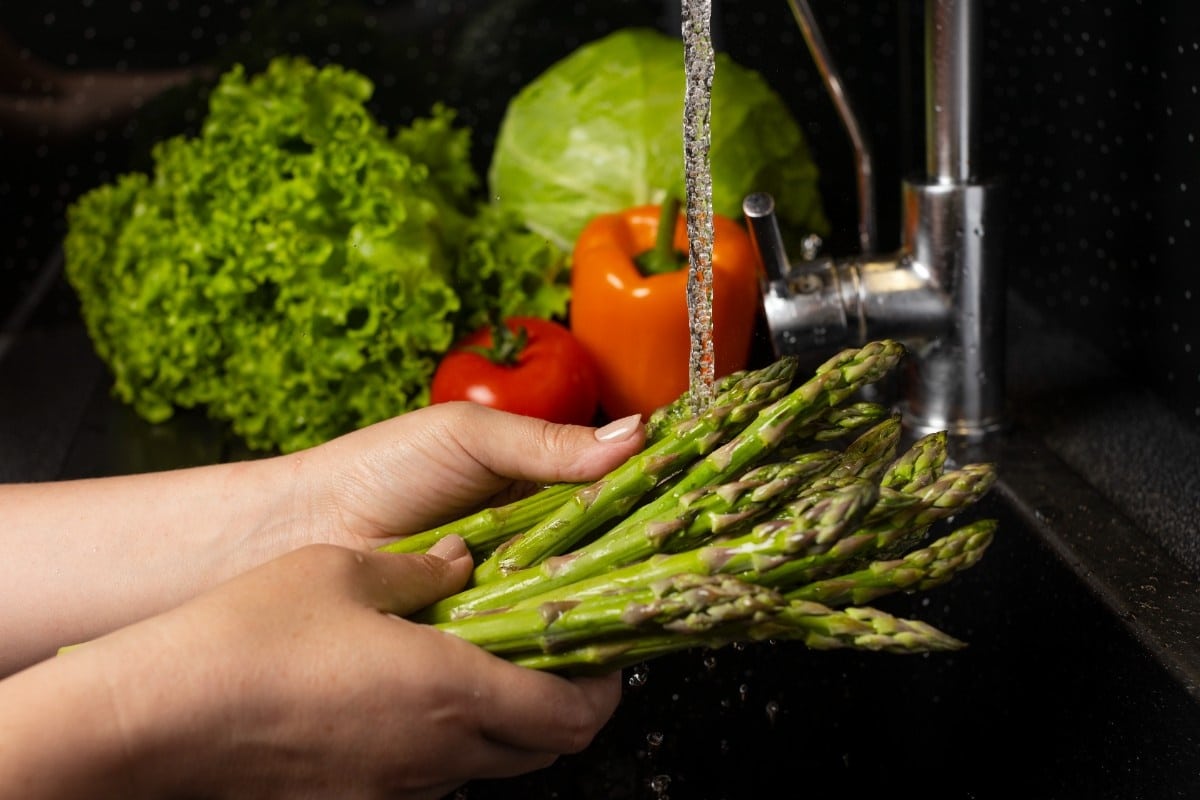 A Woman Washing Vegetables