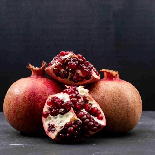 What Are The 15 Pomegranate Benefits Worth Discovering? 47 Fresh pomegranate on a table