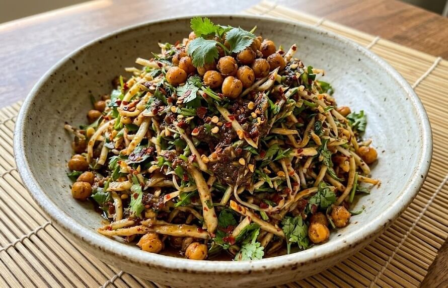 What are the Best Manipuri Cuisine Dishes to Try? 3 Singju Manipuri salad with fresh vegetables herbs and spices served in a bowl