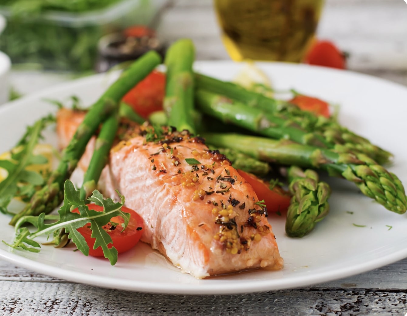 Baked salmon with steamed veggies on a plate