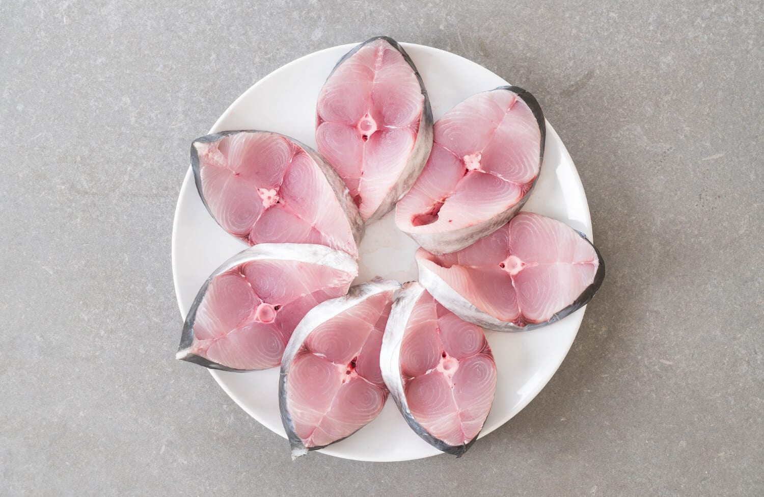 Which Heart Healthy Foods Should You Eat Daily? 2 Salmon fish sliced and dressed well on plate