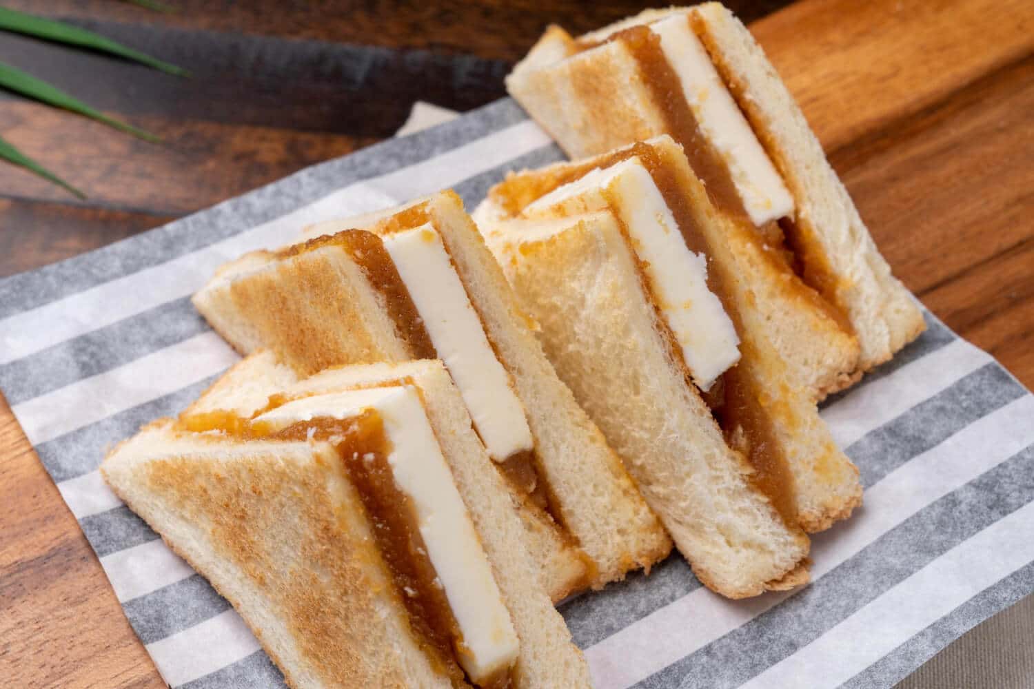 Which 25 Singapore Food Dishes Should You Try? 12 Several Kaya toast sandwiches sliced into triangles