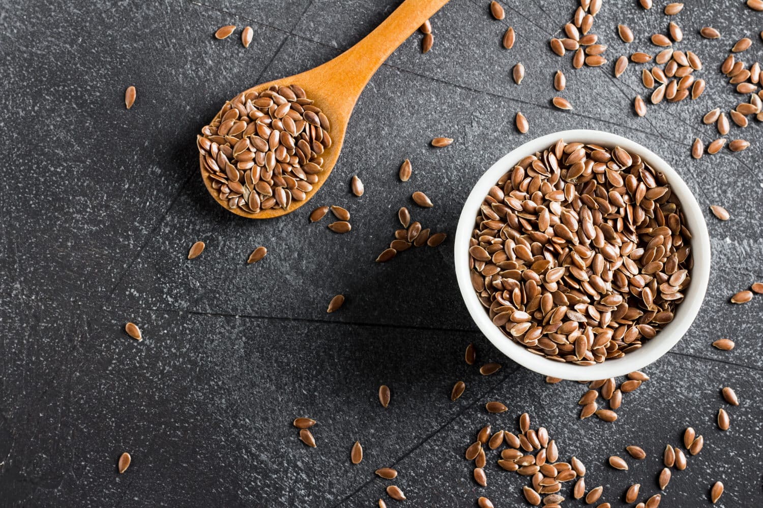 Which Heart Healthy Foods Should You Eat Daily? 6 flaxseeds on bowl placed on marble surface