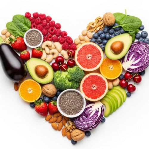 What are the Best Cholesterol-Reducing Foods for the Heart? 19 Heart shaped arrangement of fruits vegetables nuts and seeds that help reduce cholesterol