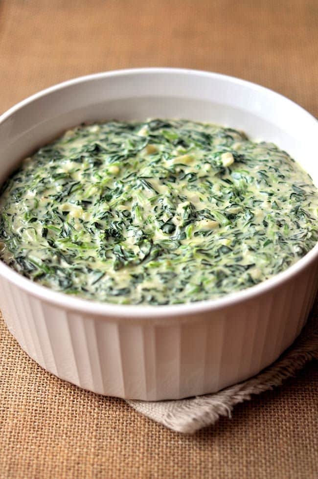 What are the Top Spinach Benefits for Health? 7 Creamed spinach dish with smooth texture and creamy consistency served warm