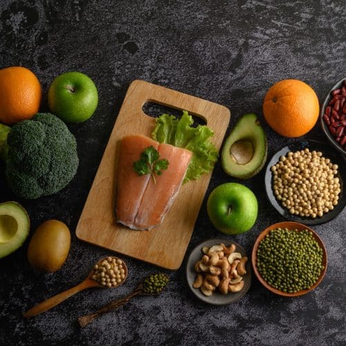 legumes fruit salmon fish pieces wooden chopping board