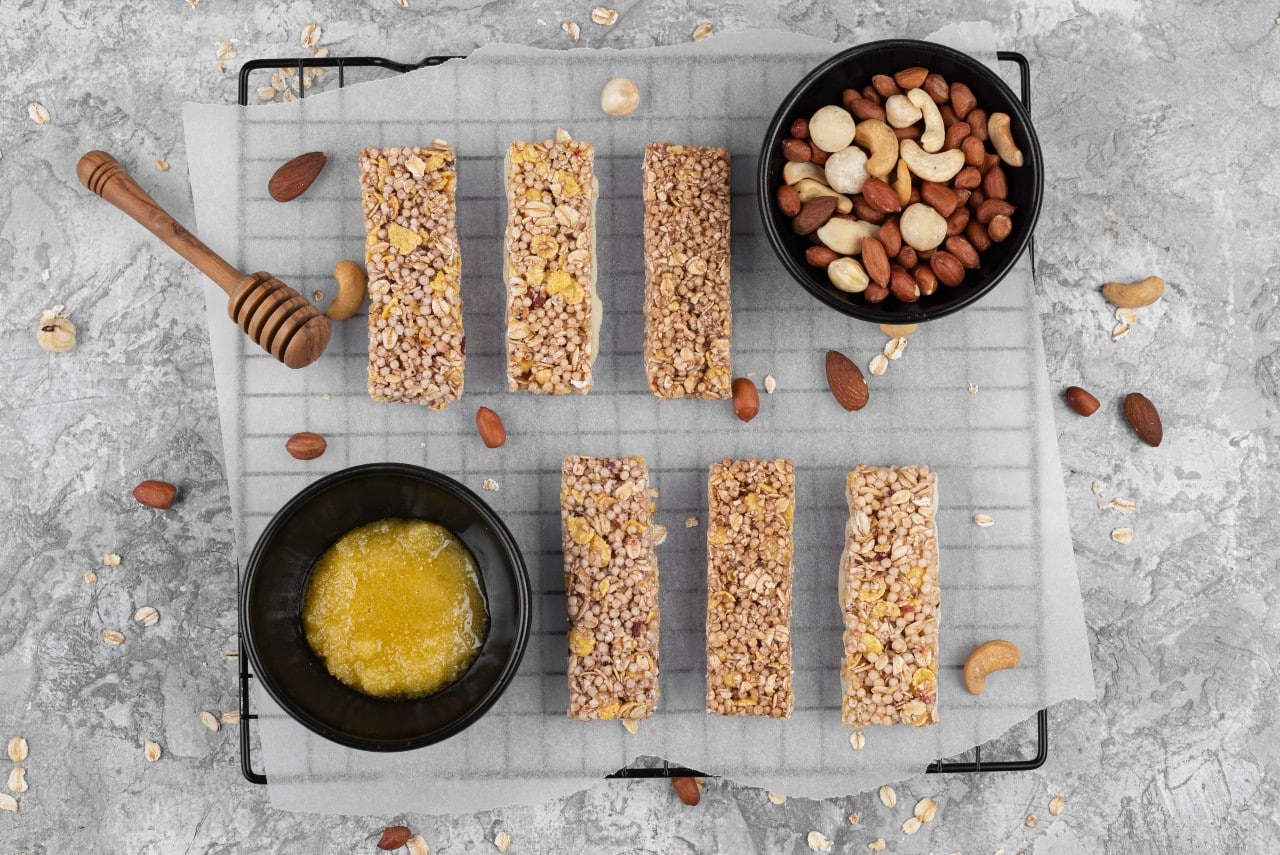 Granola bars with a bowl of nuts