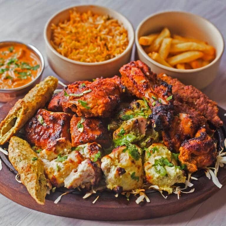 Discover The Rich History and Flavorful Delights Of Tandoori Cuisine