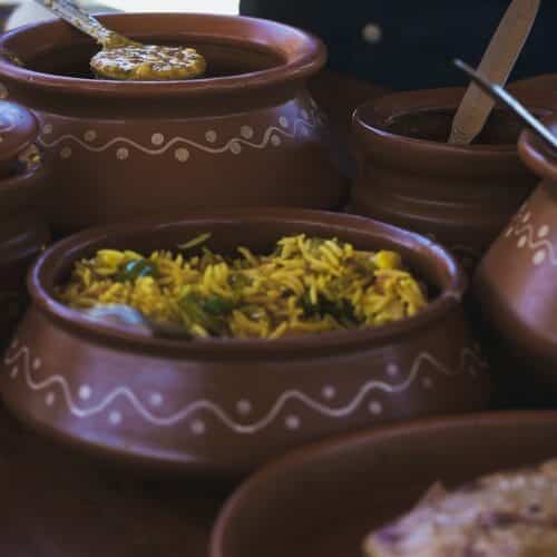 serving clay pots with food