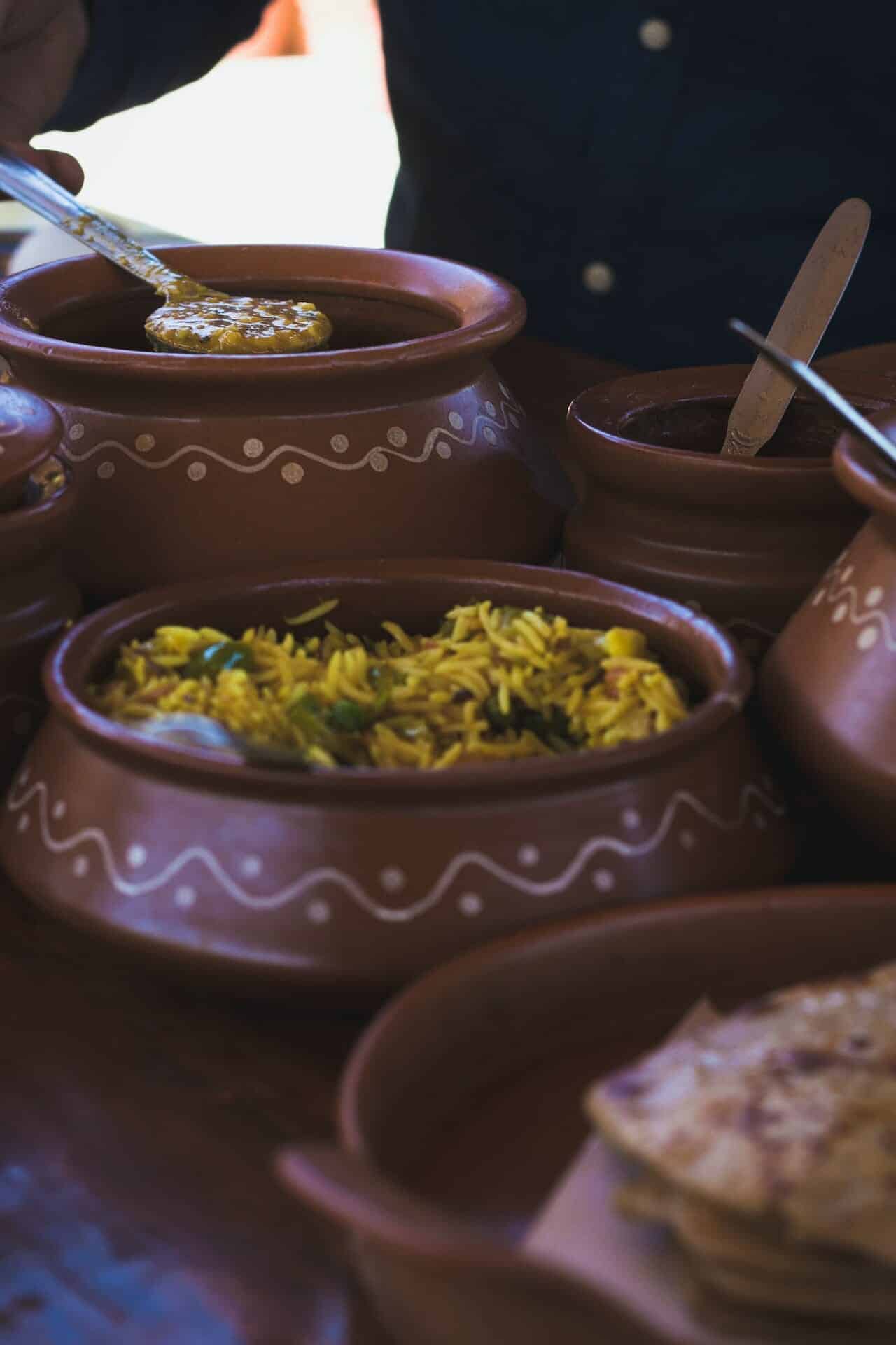 serving clay pots with food