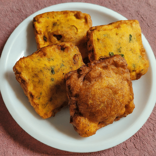 A crispy golden brown bread vada made from lentil and semolina flour