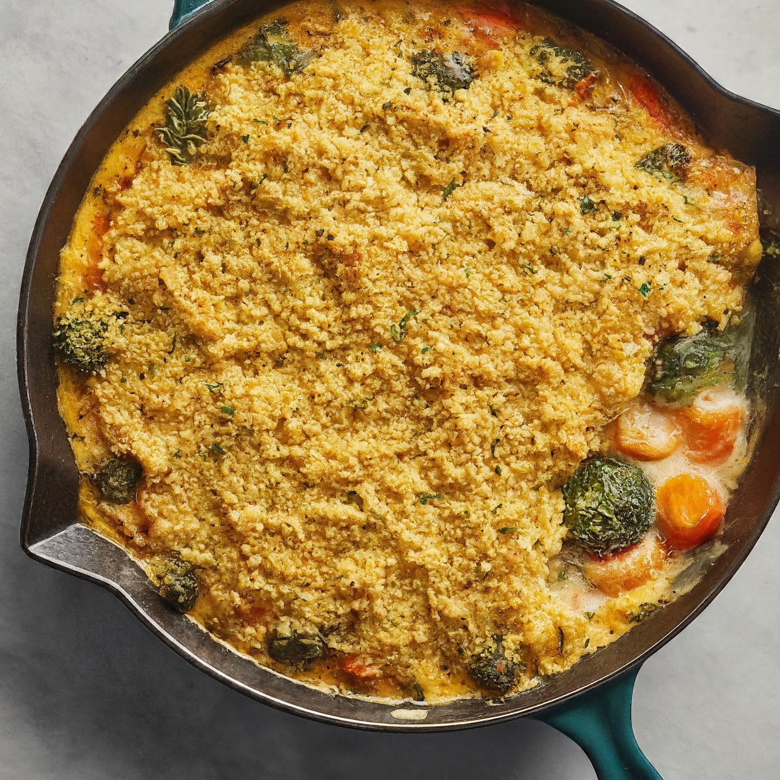 Baked Millet and Vegetable Casserole with a golden brown crust, layers of vegetables, and a creamy cheese sauce.