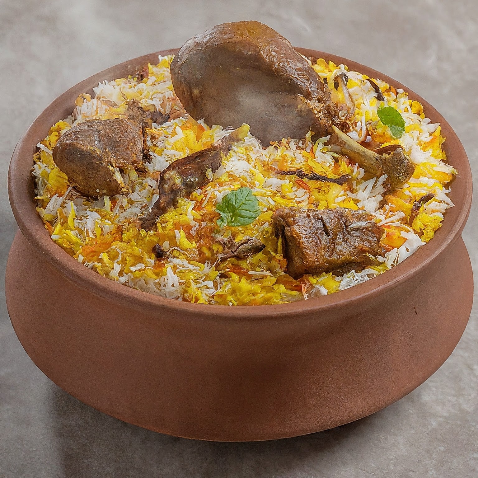 A delicious and colourful biryani dish with rice, chicken, and spices.