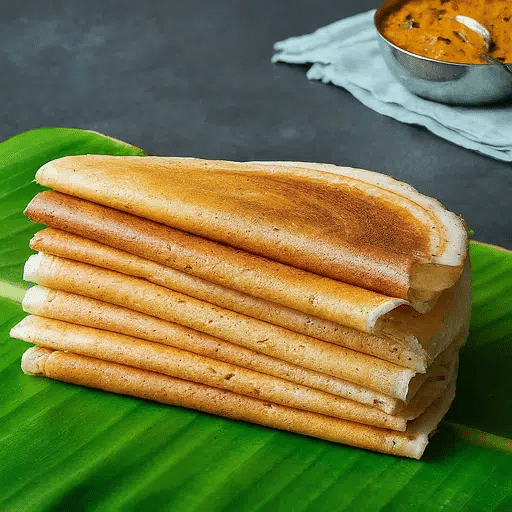 What Is Odisha’s Famous Food? 20 Must-Try Dishes 10 Chakuli Pitha soft rice pancakes from Odisha served with chutney or curry