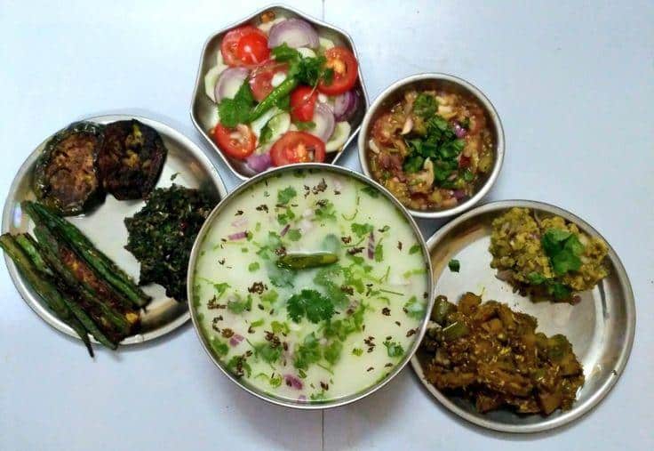 What Is Odisha’s Famous Food? 20 Must-Try Dishes 2 Pakhala Bhata fermented rice dish served with curd green chillies and side dishes