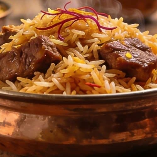 What are the Most Popular Types of Biryani in India? 63 Assorted Indian biryani styles including Hyderabadi Kolkata Malabar and Ambur biryani served in bowls with raita lemon and