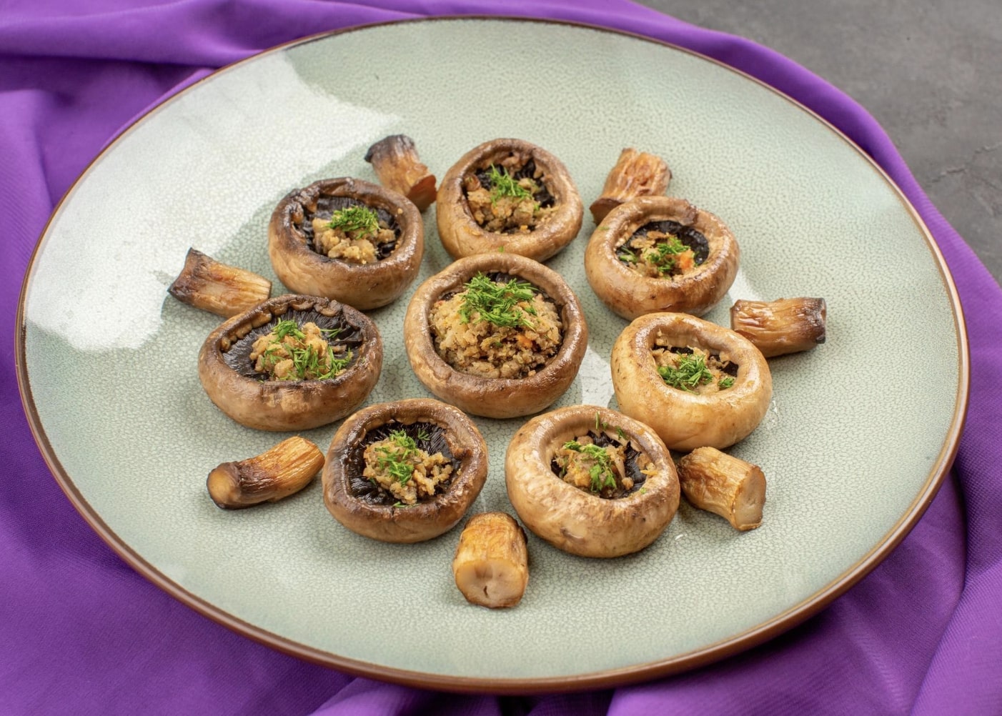 sausage stuffed mushrooms on a plate