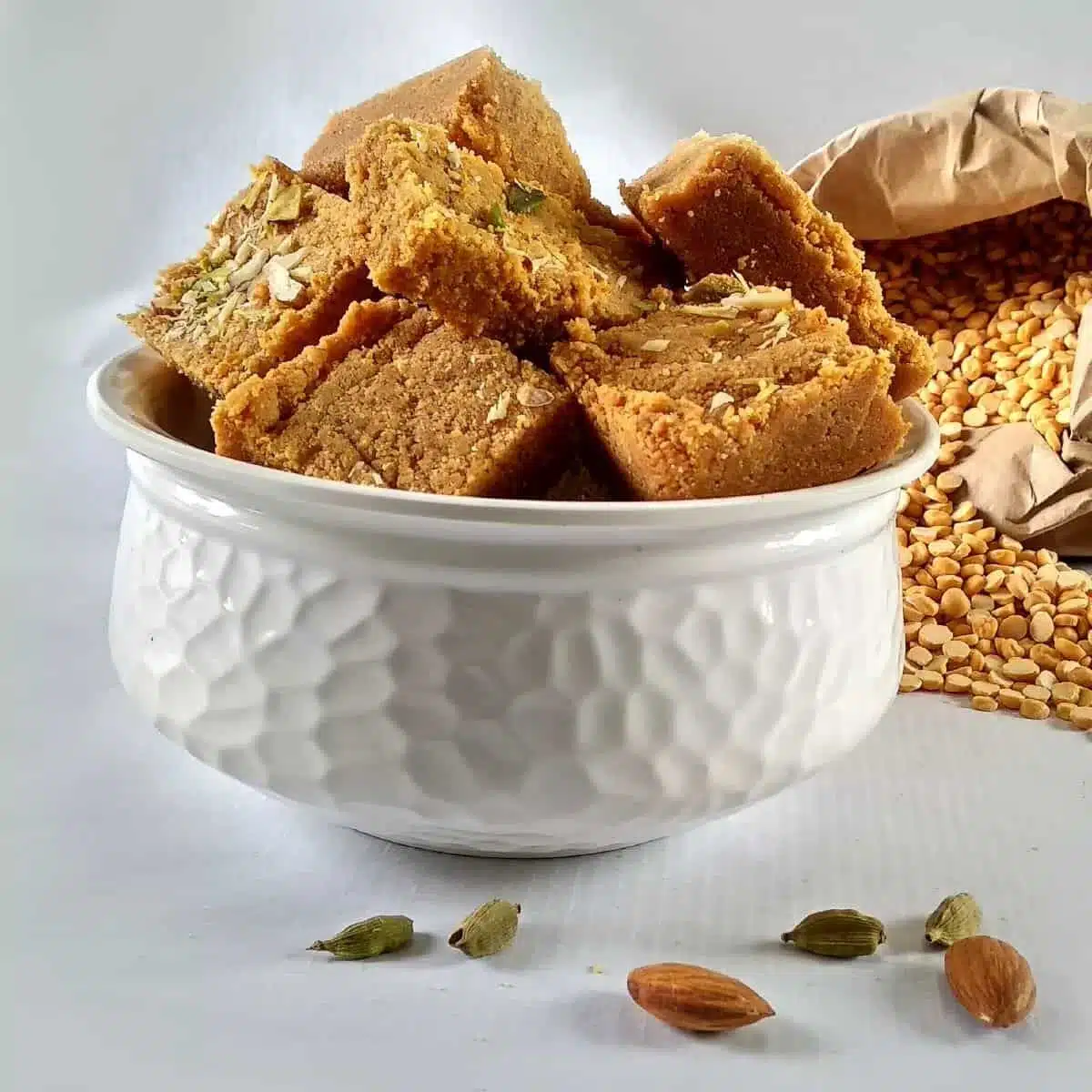 What Are the Most Popular Rajasthan Famous Food Dishes? 19 Besan Chakki traditional Rajasthani sweet made from roasted gram flour ghee and sugar cut into square pieces