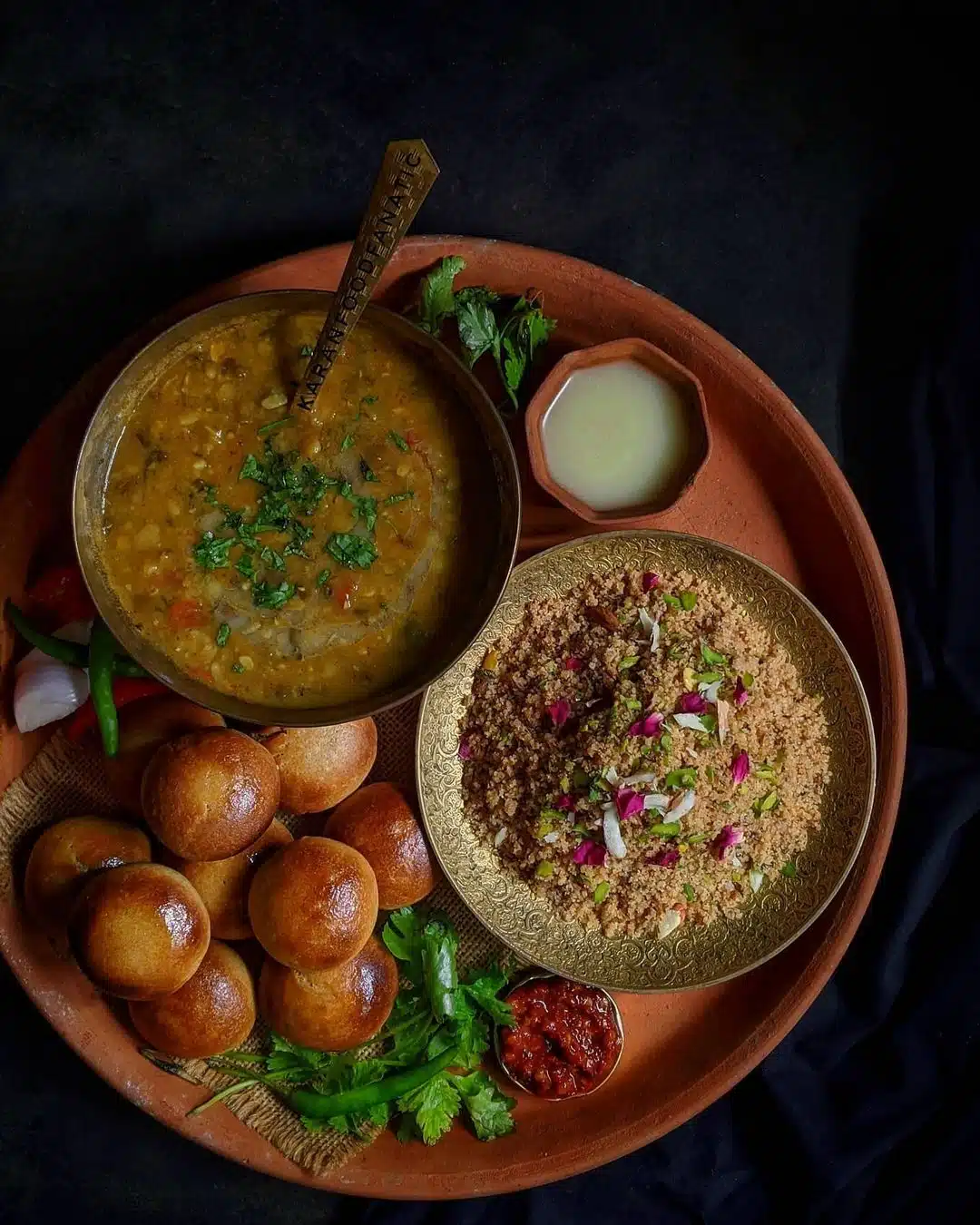 What Are the Most Popular Rajasthan Famous Food Dishes? 1 Dal Baati Churma traditional Rajasthani dish with baati dal and sweet churma served on a plate
