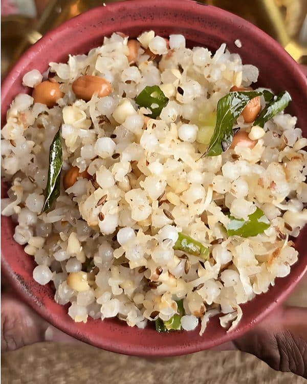 Which Famous Food of Madhya Pradesh Can You Not Miss? 4 Flavourful Sabudana Khichdi with peanuts potatoes and coriander leaves