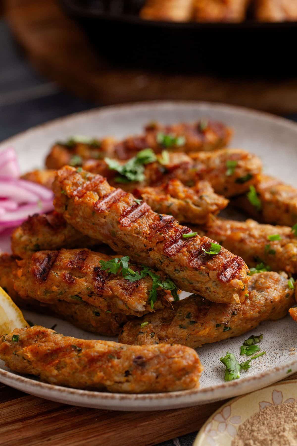Which Famous Food of Madhya Pradesh Can You Not Miss? 8 Juicy Seekh Kebabs grilled with aromatic spices and herbs