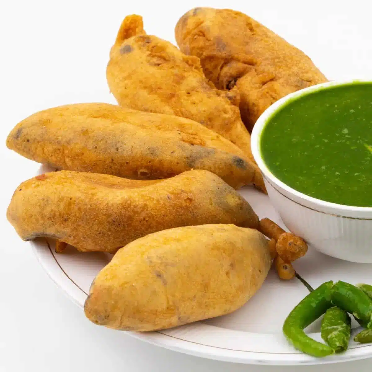 What Are the Most Popular Rajasthan Famous Food Dishes? 11 Mirchi Bada crispy Rajasthani street snack made with stuffed green chillies coated in gram flour batter