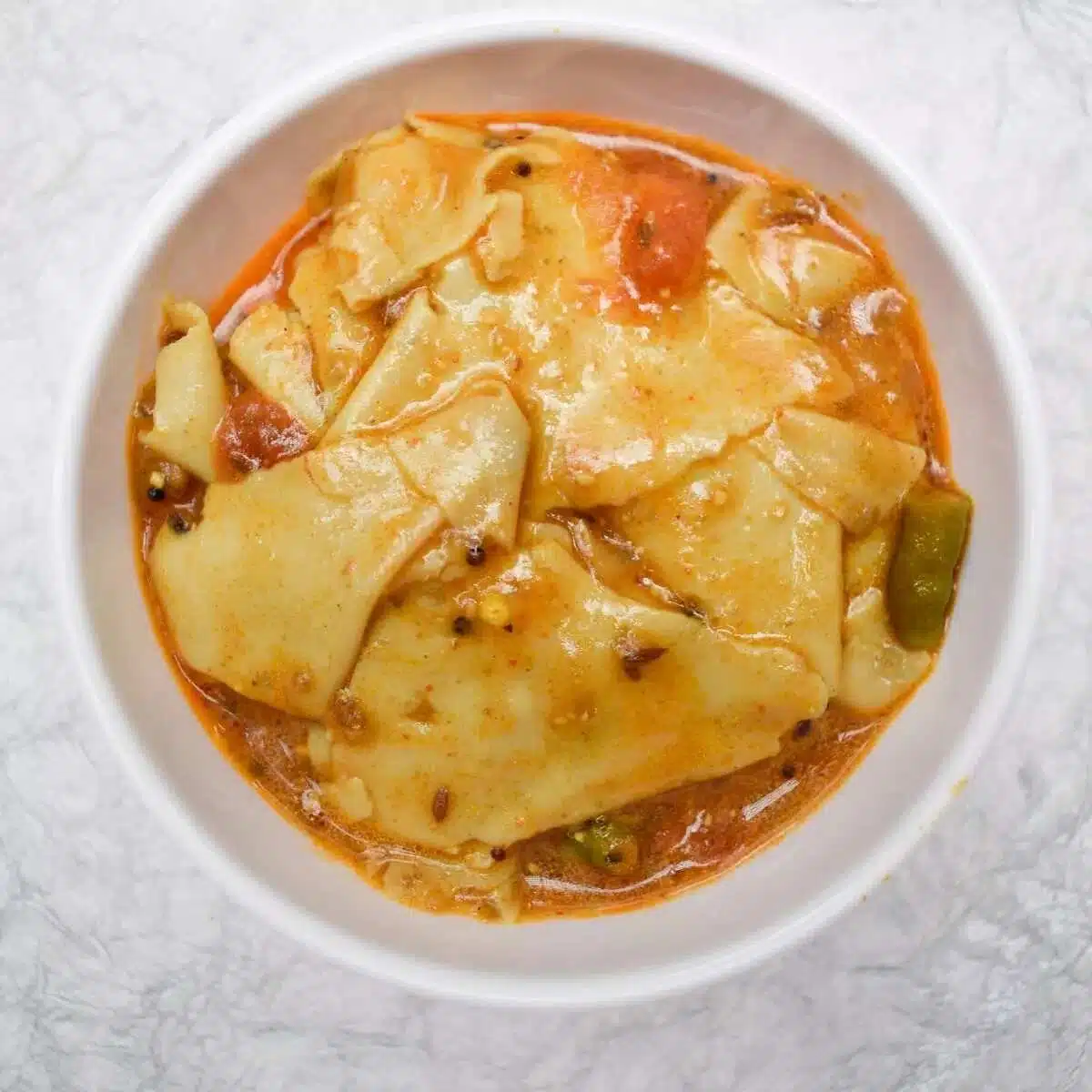 What Are the Most Popular Rajasthan Famous Food Dishes? 13 Papad Ki Sabzi traditional Rajasthani curry made with papad in spiced yogurt gravy