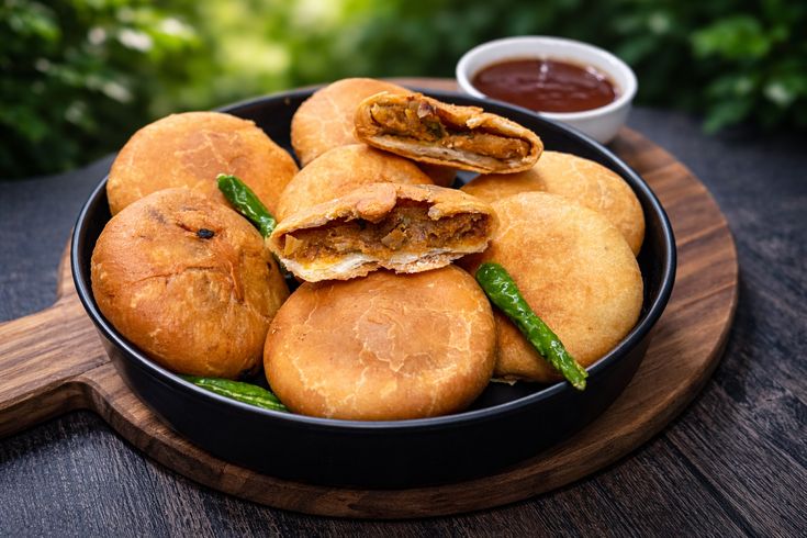What Are the Most Popular Rajasthan Famous Food Dishes? 4 Pyaaz Ki Kachori crispy Rajasthani snack stuffed with spiced onion filling served hot