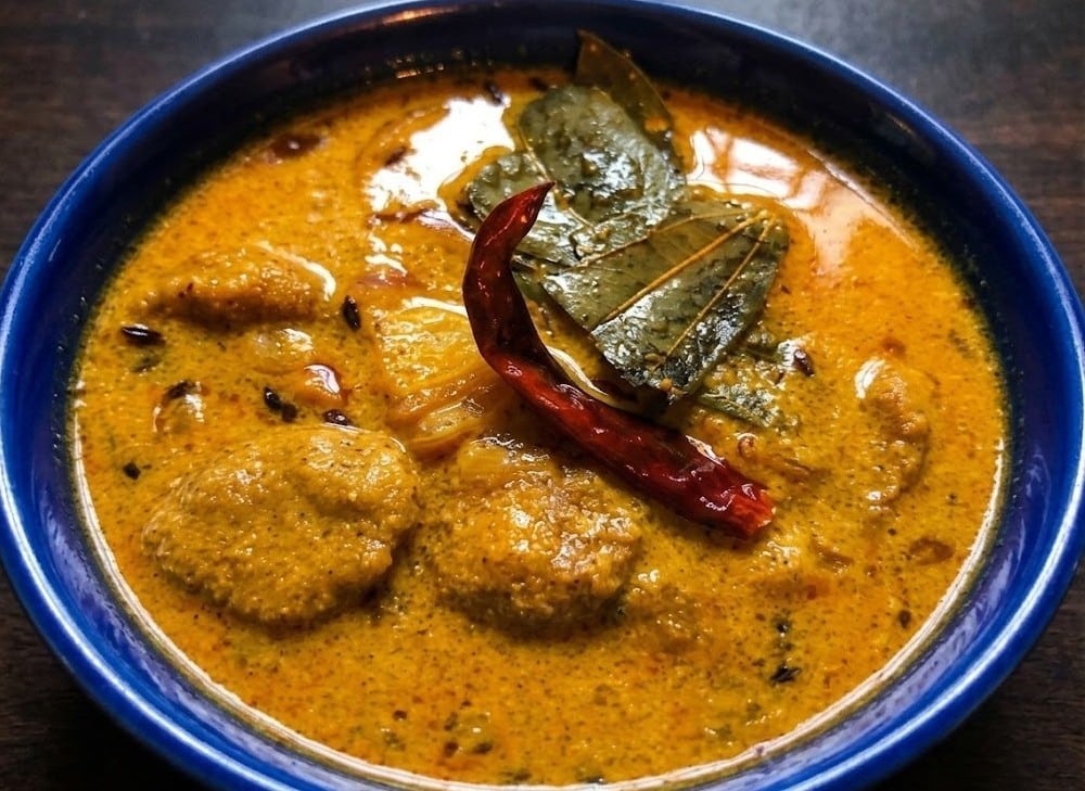 Which Famous Food of Madhya Pradesh Can You Not Miss? 9 Traditional Chakki Ki Shaak with steamed wheat pieces in yogurt gravy