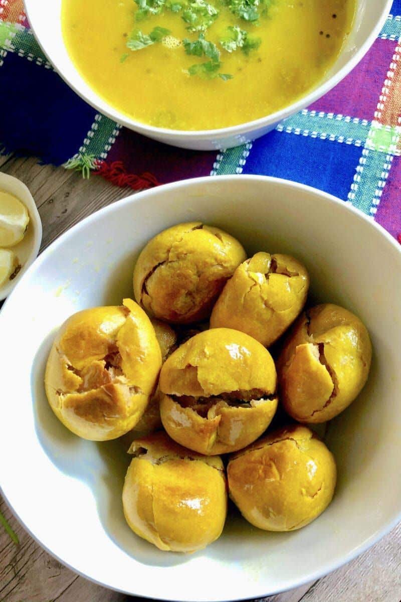 Which Famous Food of Madhya Pradesh Can You Not Miss? 2 Traditional Dal Bafla served with spicy lentil curry and melted ghee