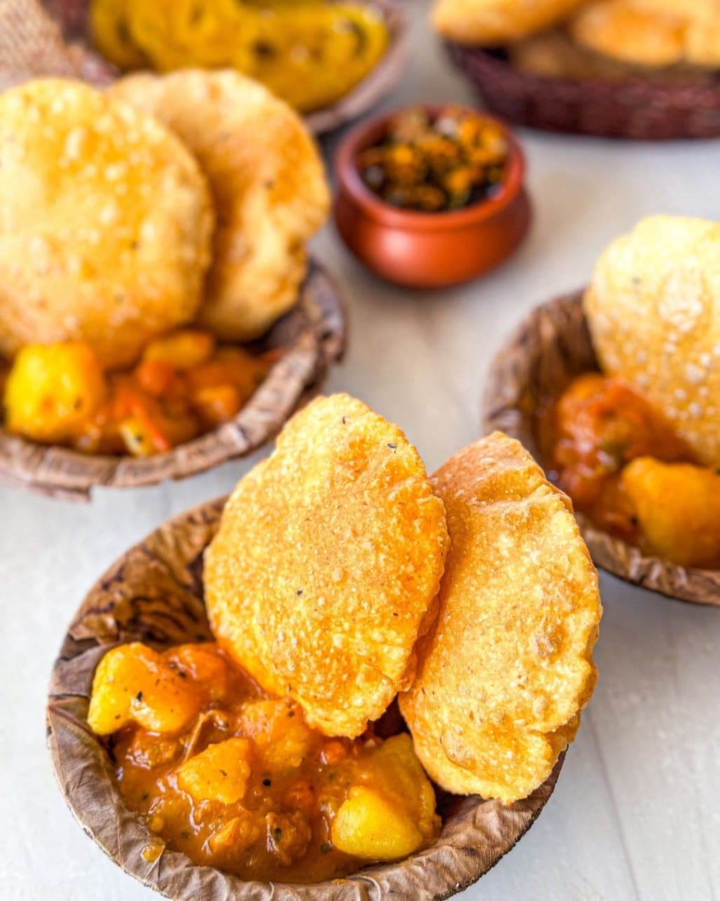 What Are the Most Famous Foods of Uttar Pradesh? 12 Kachori sabzi with crispy stuffed kachoris served alongside spicy potato curry