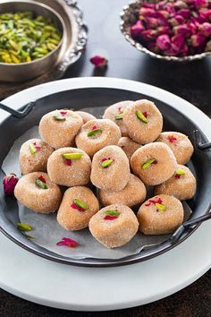 What Are the Most Famous Foods of Uttar Pradesh? 14 Mathura peda with a dense grainy texture made from caramelised khoya and shaped into small discs