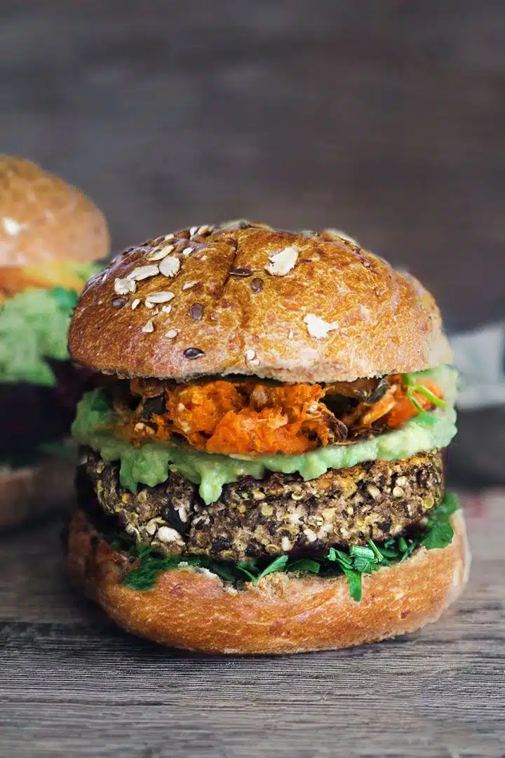 Plant based burger filled with vegan patties and leaves