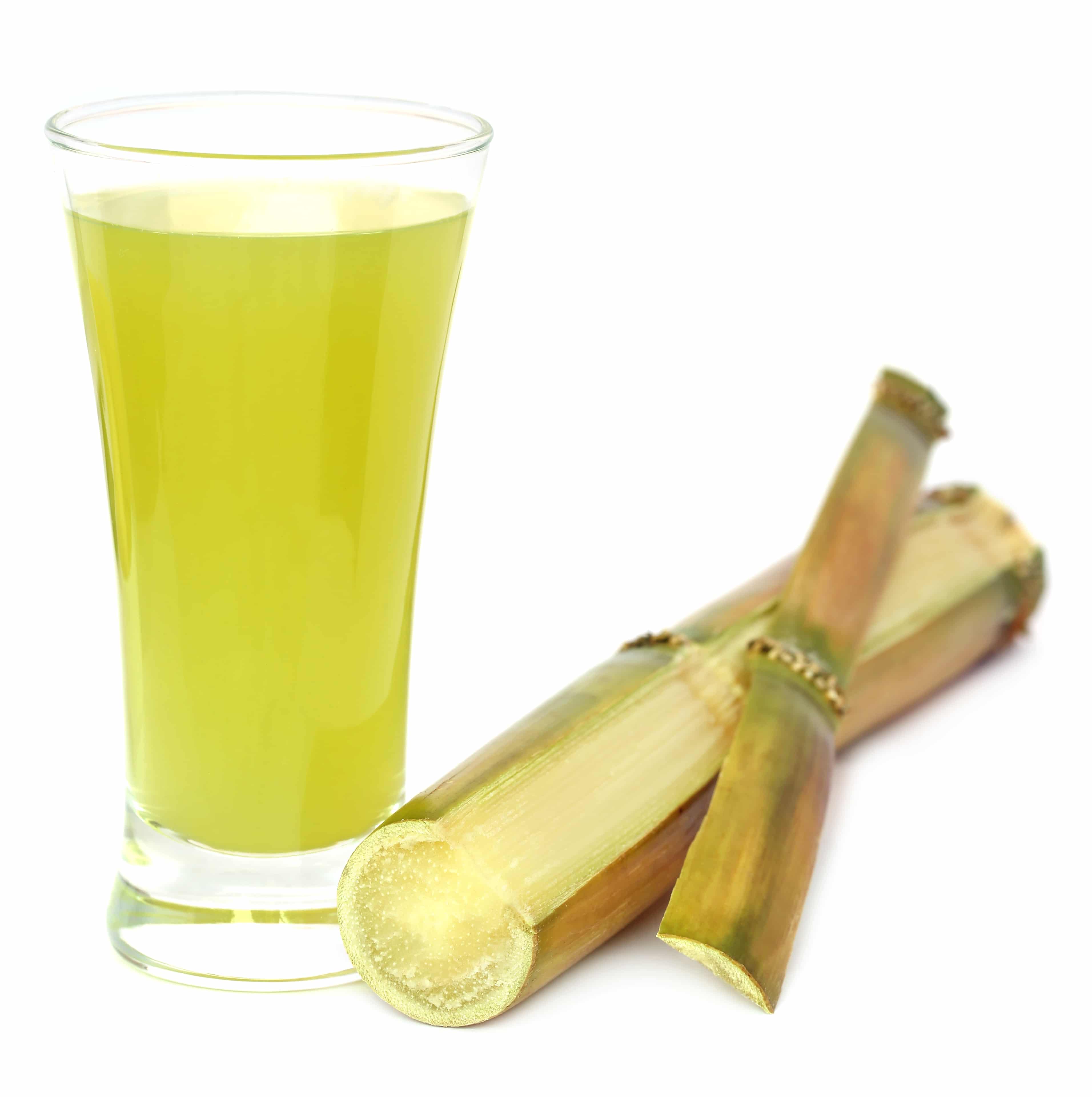 Sugarcane with juice in a glass