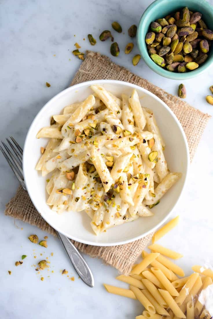 a plate full of creamy italian pasta