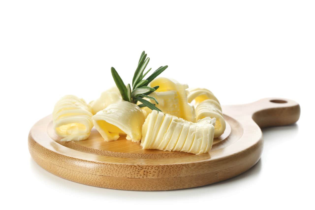 15 Healthy Recipe Substitutions for a Guilt-Free Meal 14 Butter on a wooden platter