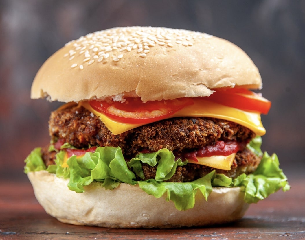aloo tikki burger with cheese and veggies