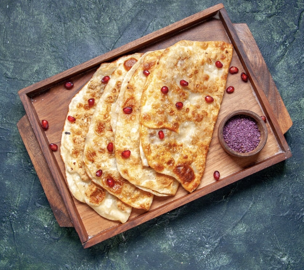 paratha on a wooden plate