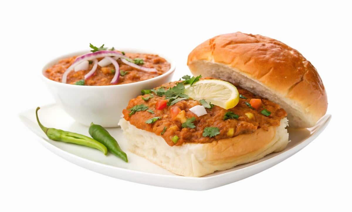 What are the 10 Best Ideas for Cooking Without Fridge? 1 A plate of Pav Bhaji with a bun and a side of curry garnished with coriander leaves onions and a slice of lemon accompanied by green chilies