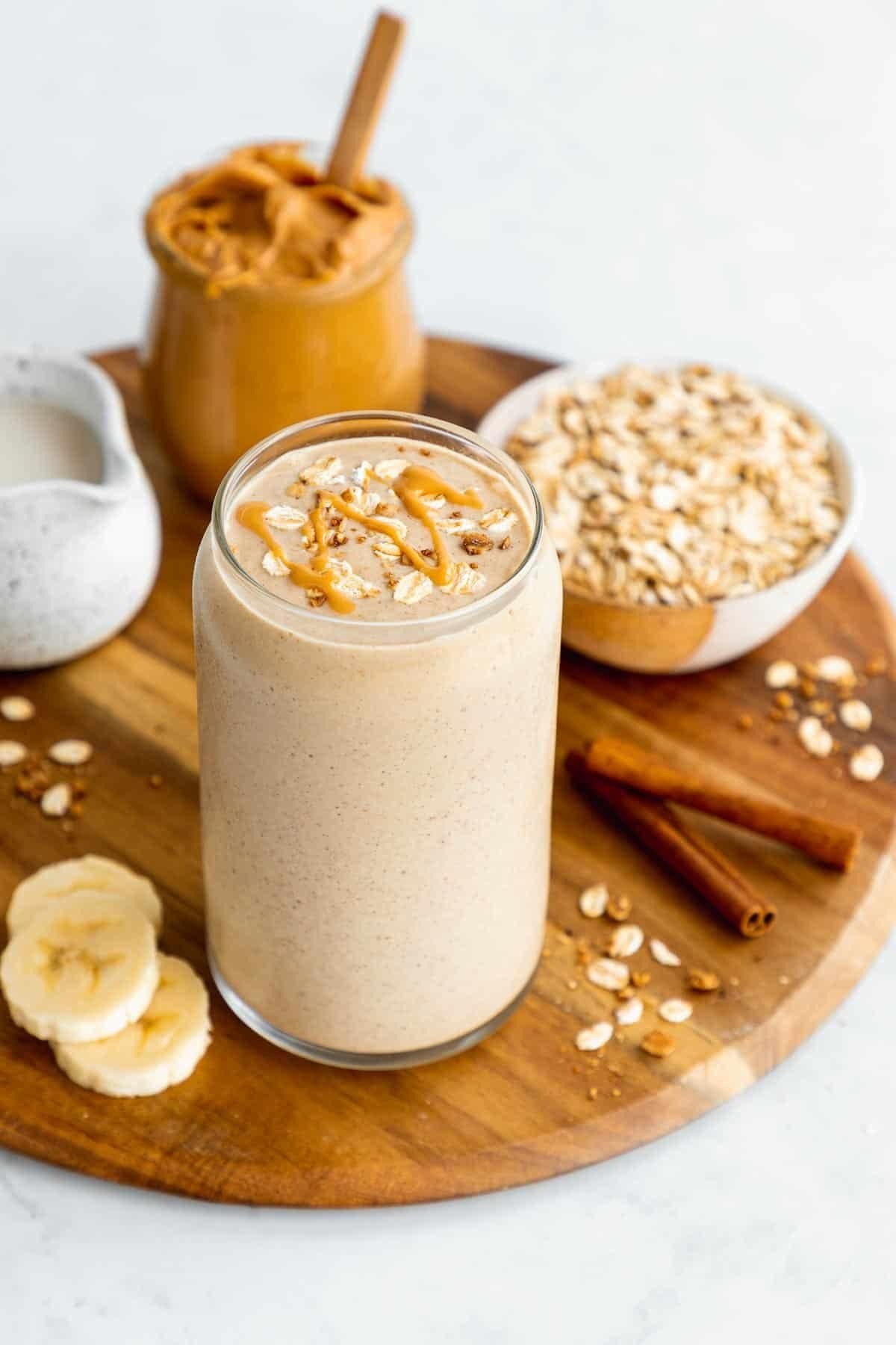 What Are the Benefits of Smoothies and Juices for Health? 5 Banana peanut butter smoothie topped with banana slices and peanut butter