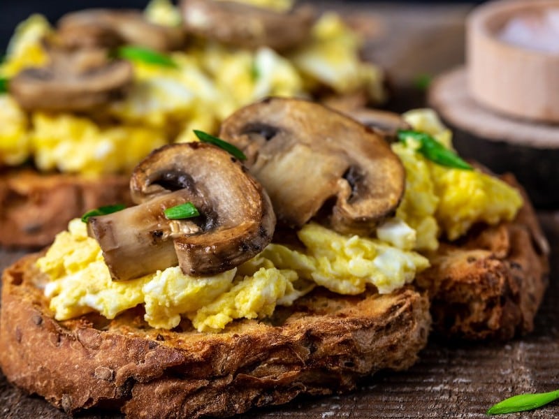 Which 10 Instant Hangover Cure Tips Should You Try Today? 10 Close up of scrambled eggs and mushrooms served on crunchy toast