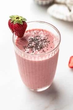 What Are the Benefits of Smoothies and Juices for Health? 10 Strawberry chia smoothie topped with fresh strawberries and chia seeds
