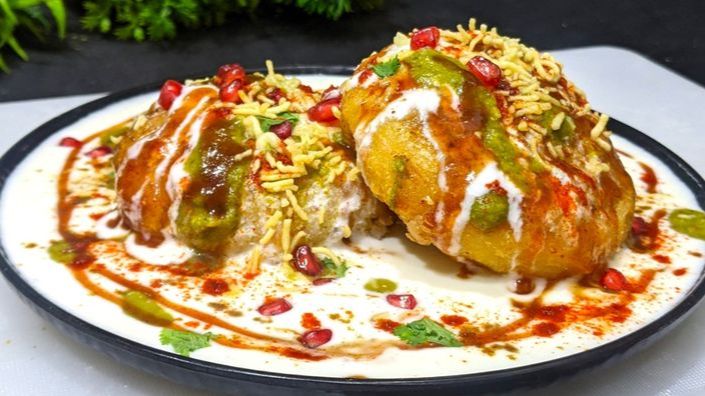 What Are the 25 Best Brunch Dishes for Weekend Meals? 51 Aloo tikki chaat topped with yoghurt chutneys and sev for Indian brunch