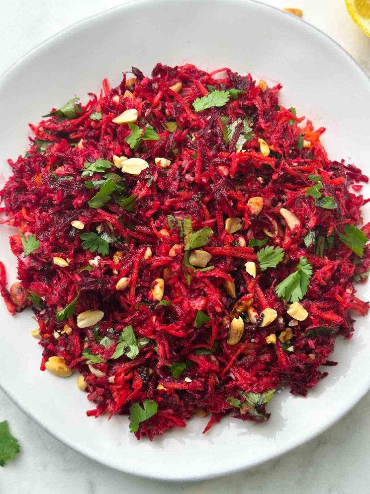 What Are the Health Benefits of Beetroot in Daily Diets? 13 Fresh beetroot salad with cucumber carrot onion and herbs served in a bowl
