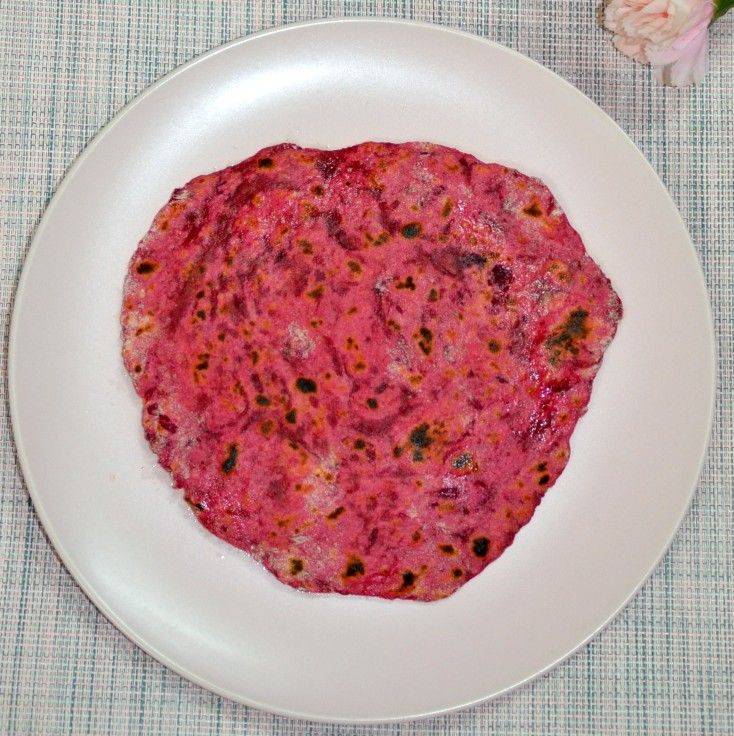 What Are the Health Benefits of Beetroot in Daily Diets? 17 Freshly cooked beetroot paratha served with yoghurt and pickle on a plate