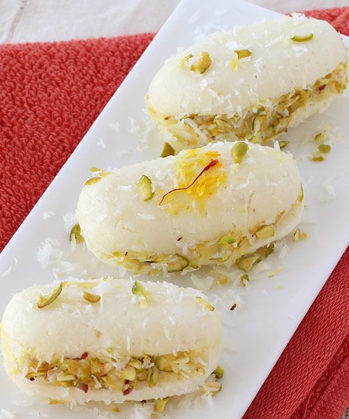What Are the 25 Best Indian Sweets Everyone Loves? 51 Soft cham cham sweet topped with coconut flakes
