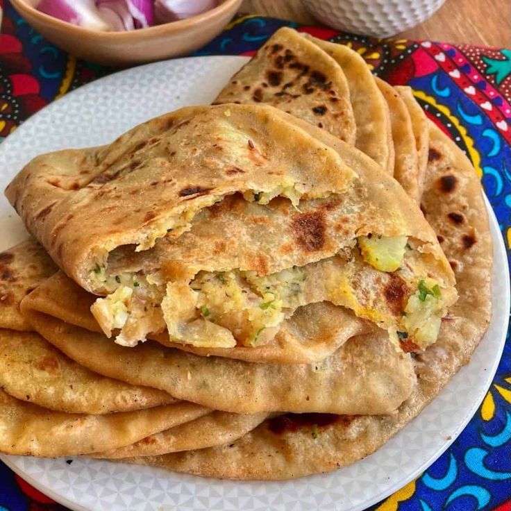 What Are the 25 Best Brunch Dishes for Weekend Meals? 34 Stuffed parathas served with curd and pickle for Indian brunch